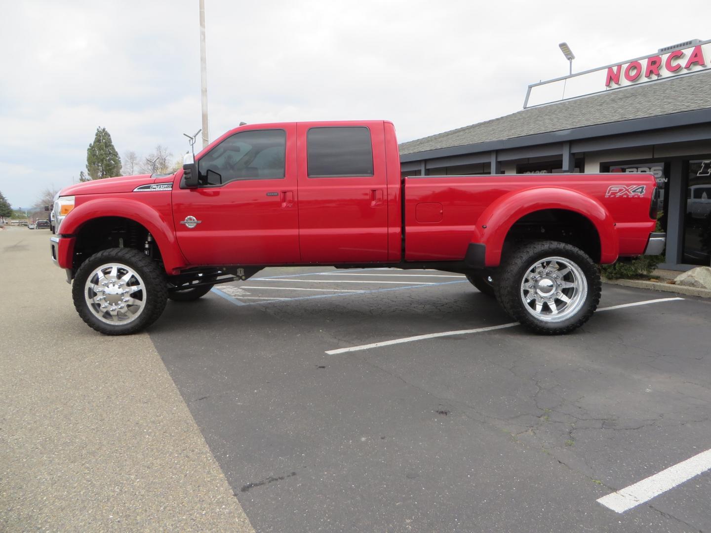 2014 Red /TAN Ford F450 Super Duty Crew Cab Lariat Crew Cab 4WD (1FT8W4DT7EE) with an V8 Turbo Diesel 6.7 Liter engine, Automatic 6-Spd w/SelectShift transmission, located at 2630 Grass Valley Highway, Auburn, CA, 95603, (530) 508-5100, 38.937893, -121.095482 - Wow!! 14 F450 sitting on Icon Vehicle Dynamics suspension, 24" American Force wheels, 37" tires, Rough Country back up leds, Light bar, Window tint, Smoked tail lights 3rd brake light, cab lights, and marker lights, Air bags with compressor, and train horns. Must see this head turner! - Photo#7